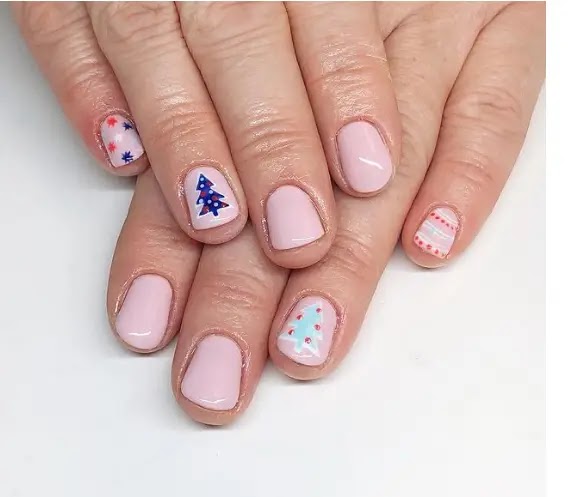 Pink and blue - the most prominent drawings of manicure for Christmas this year: