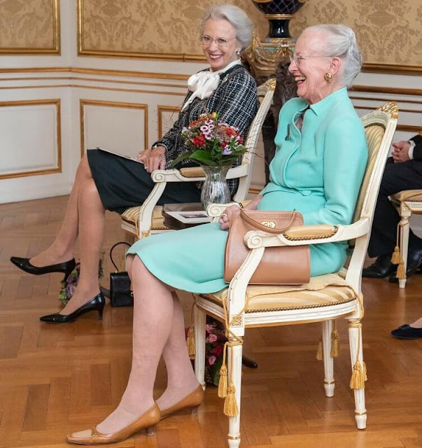 Queen Margrethe designed the Cross Stitch of the Year 2023. Queen Margrethe wore an aquamarine coat, jacket and skirt