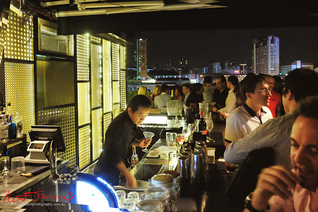 A view of the bar and the rooftop view of Singapore at Screening Room. Photo by Kent Johnson for Street Fashion Sydney.