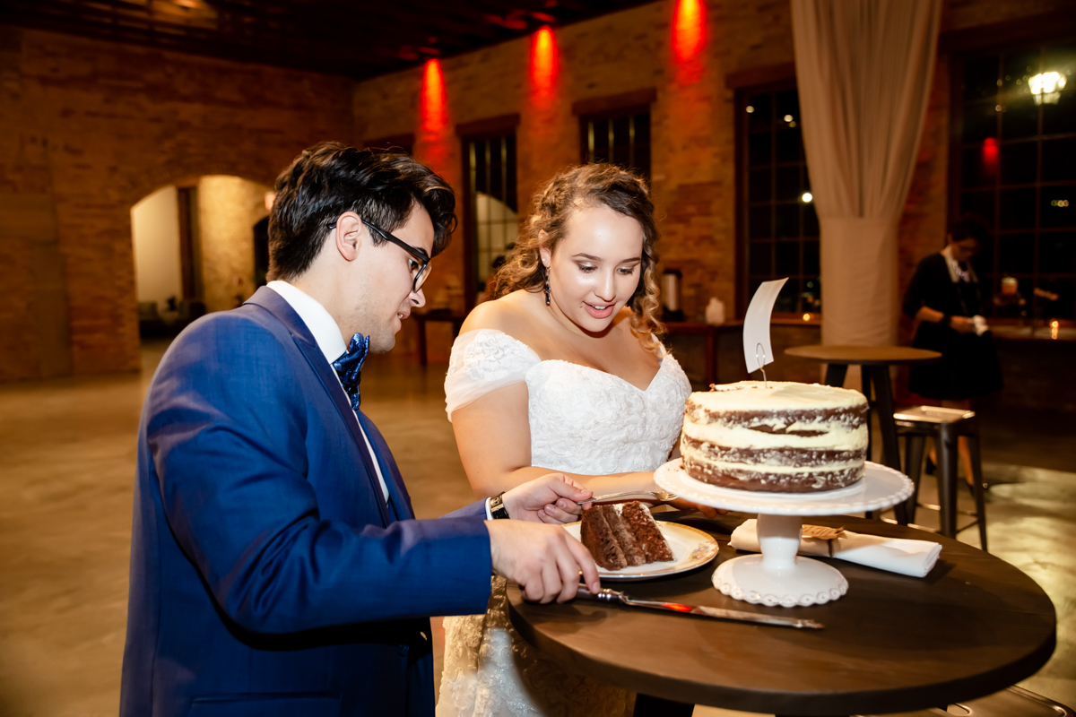 Couple sharing cakes together on their big day