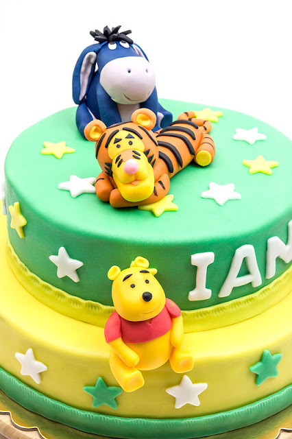 Winnie the Pooh fondant cake close up on winnie and tigger and eeyoe