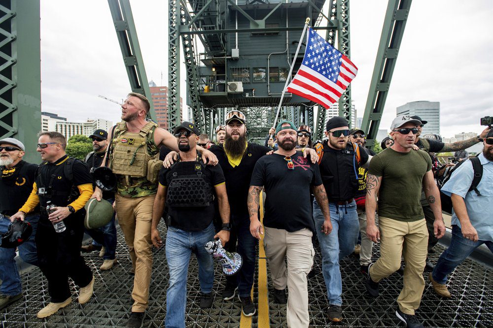The Proud Boys march as free men before their persecution by the Biden Regime.