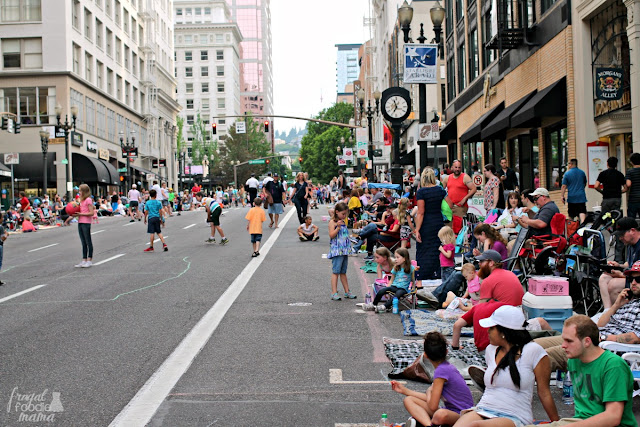 City-goers line up on the streets for the Starlight Parade that features an impressive line-up of illuminated floats as the sun goes down over the city streets during the Portland Rose Festival each year.