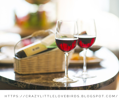 Two wine glasses displayed on a table