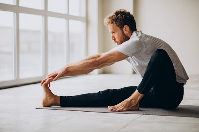 man practicing flexibility exercise