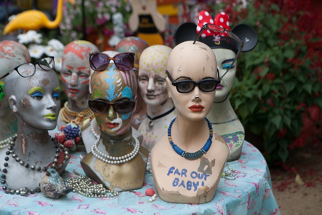 Mannequin heads covered in graffitti and jewellery and all sorts of grunge-like decoration