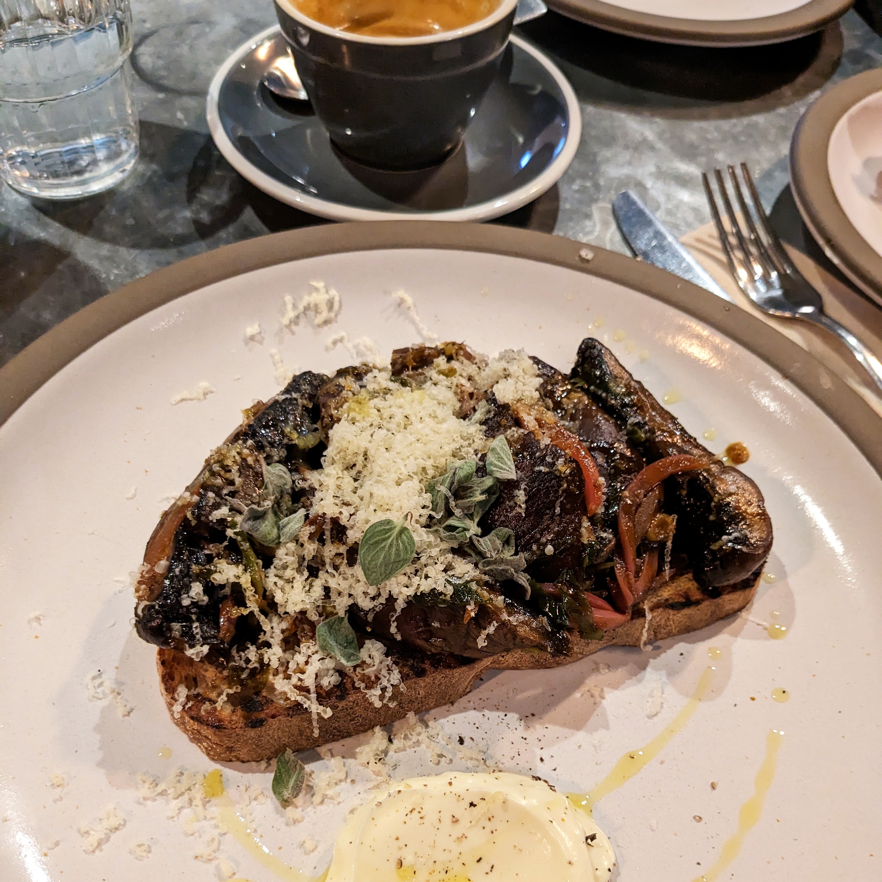 A plate of mushrooms on toast at Ozone coffee in shoreditch, it's one of the best places to get a unique breakfast in london