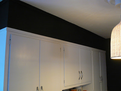 mylittlehousedesign.com black walls with white kitchen cabinets