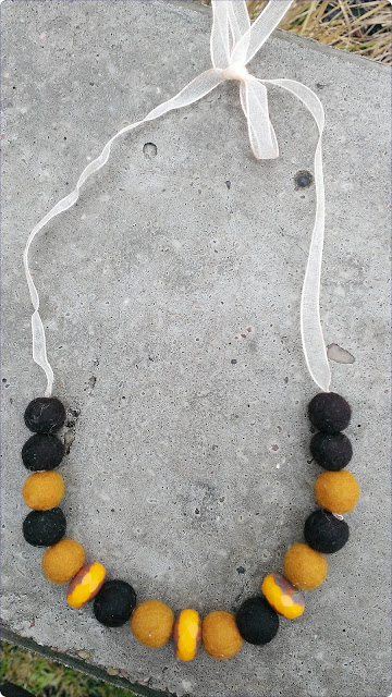 Gold and black felted necklace with ribbon