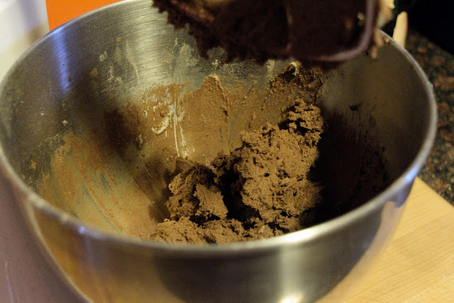 The chocolate dough for the cookies in the mixer. 