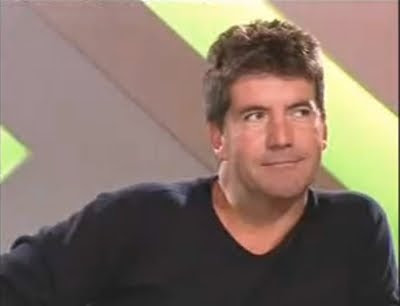 Simon Cowell X Factor Britain American Idol judge smirk smile screencaps images photos pictures screengrabs captures