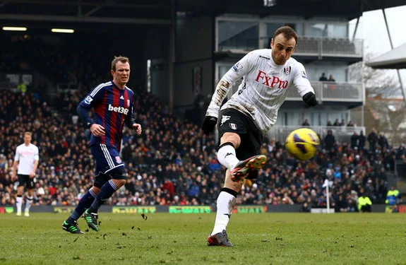 Fulham striker Dimitar Berbatov shoots and scores the winning goal against Stoke