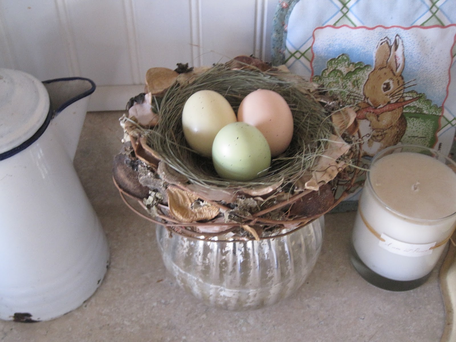 This is the $1.99 nest from Home Goods. The little bunny pot-holder is ...