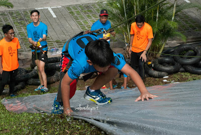 Soapy climb at one of the obstacles at Safra AVventura 2016