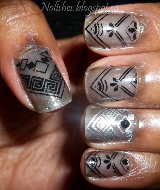 Nail Stamping manicure with a sheer black base, stamped with a variety of chevron designs in black and silver nail polish.