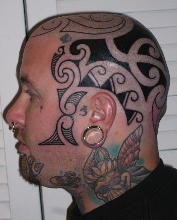 Tribal art head tattoo with skull butterfly on neck