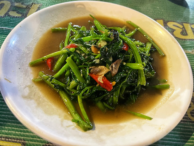 smoky morning glory and red chili stir-fried in a wok