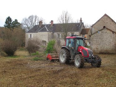 Tractor clears the garden