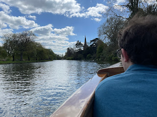 The back of John's head with the River Avon in front of him on our boat ride.