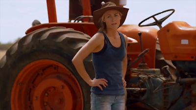 Julia Billington as Trish working on the farm in All About E (2015) movie