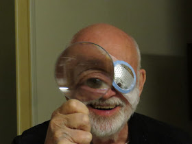 eye seen through magnifying glass