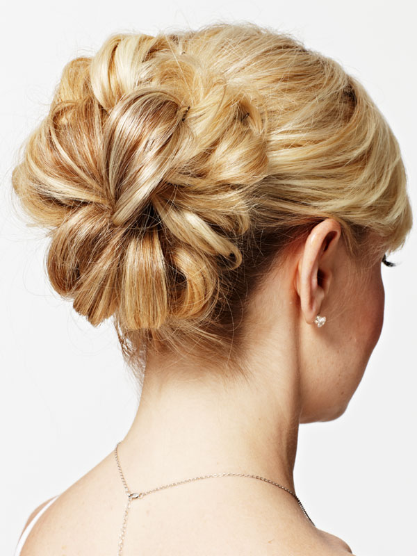 Creating a loose updo hairstyle can be done in a variety of ways using