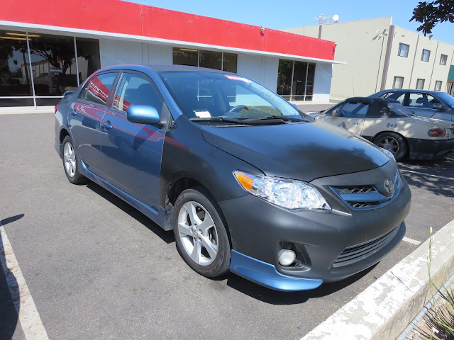 Corolla repaired by customer but needs paint.