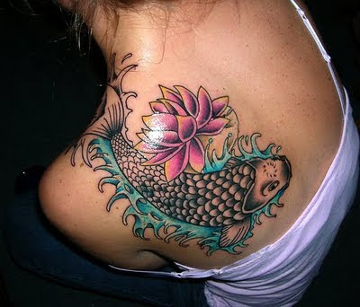 tattoos with lotus flower tattoos and KOI FISH TATTOOS on shoulder blade