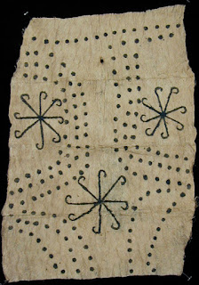 Mbuti culture barkcloth with sun-wheel-like motif.