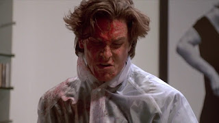 Image of Bateman covered in blood