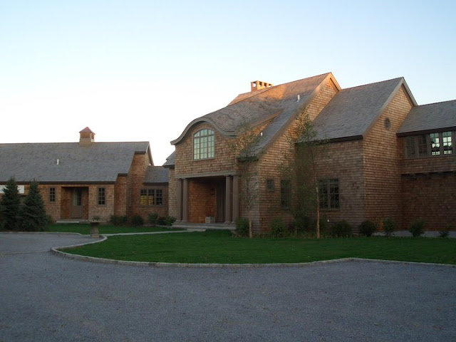 Photo of front entrance and driveway in front of restored cottage