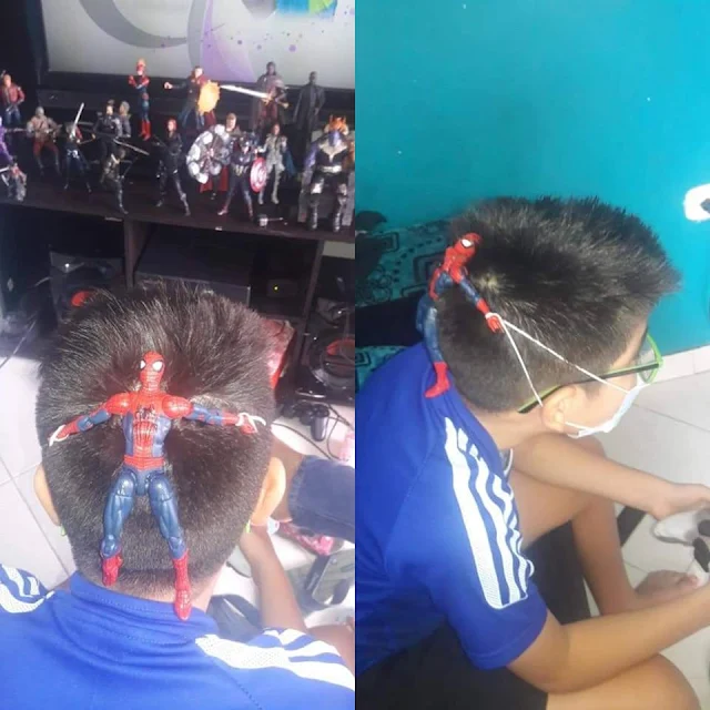 criança usando máscara com boneco do homem aranha