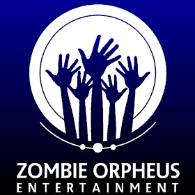 The ZOE logo: a white circle with five hands rising up from the bottom in silhouette, as if they were the hands of zombies erupting up out of the ground. A short arc, about a quarter the circumference of the white circle, concentric with the white circle, runs along the bottom edge of the circle, bisecting three dots. This logo, which is white on a background of dark blue fading to black in gradient, is the inverse of the normal colours: a black logo on a white background.