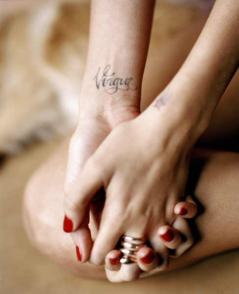 Wrist tattoos Virgin on the right and a shooting star on the left