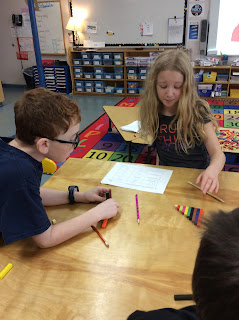 Students using cuisinaire rods to explore fractions. 