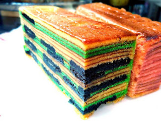 Green kueh lapis with cookies and cream layers.