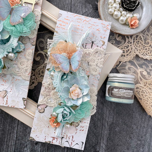 Mixed media panels created with: Prima Marketing apricot honey, peach tea, coffee break flowers, mechanicals grungy succulents, opal magic paint, moulds; Reneabouquets butterflies, glitter glass; Tim Holtz baubles