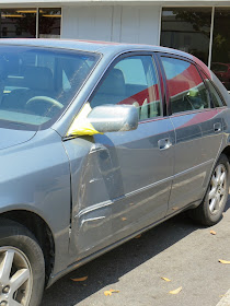 Damaged door, mirror and handle on 2001 Toyota Avalon at Almost Everything Auto Body