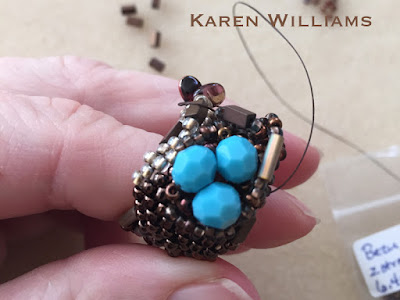 Just starting to work on the 'nest'.  Freeform peyote ring by Karen Williams