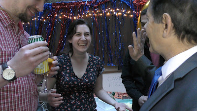 Image of Boston Magician Joe Ferranti entertaining smiling and laughing spectators in The North End of Boston.