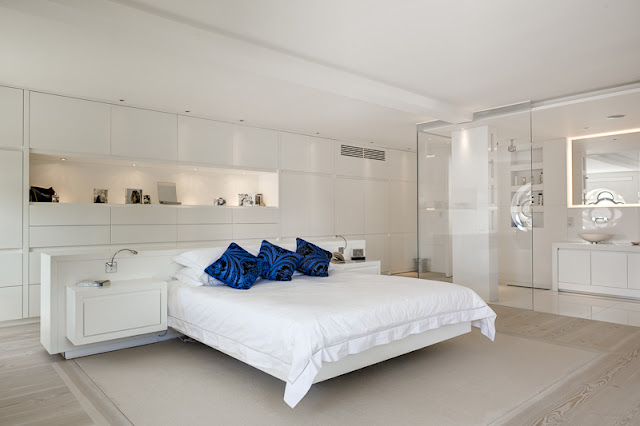 Picture of floating bed in the modern bedroom with white furniture