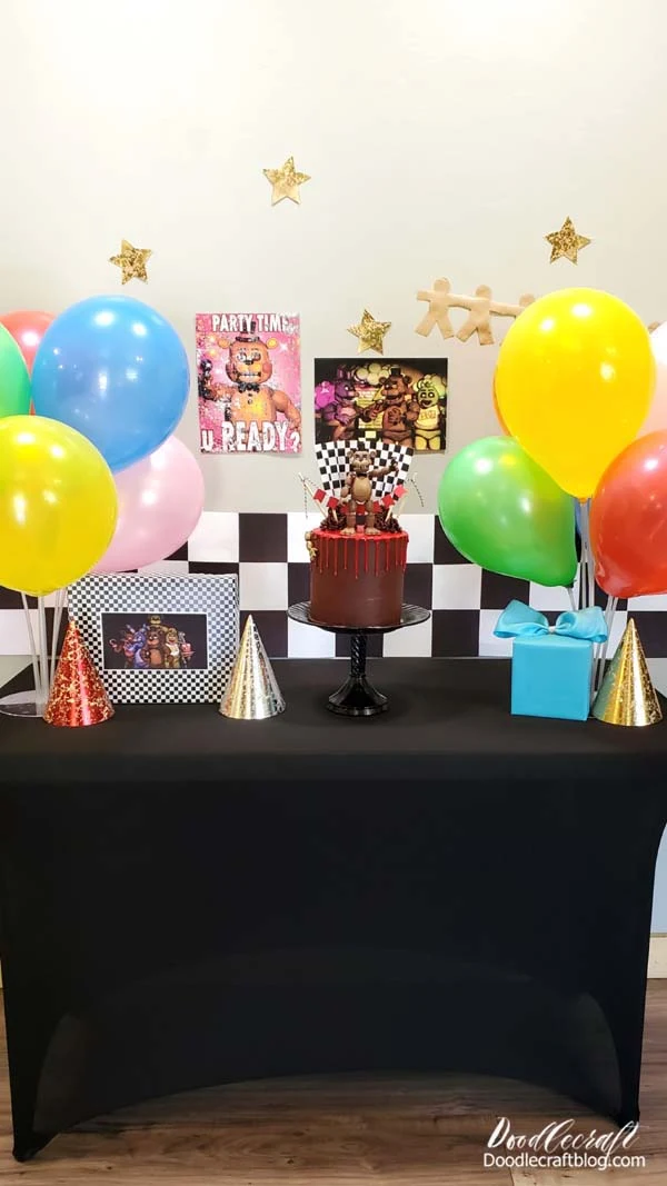 The balloon stands are so familiar of the 80's for birthday parties!   I remember as a child, we NEVER got helium balloons...but my mom had these balloon holders and sticks.    It gives the illusion of big balloon bouquets...perfect for a FNAF party!
