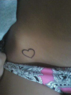 Little Heart Tattoo with identical black heart tattoos