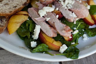 a photo of a grilled pork tenderloin salad with grilled nectarines