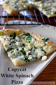 Fresh spinach, feta and mozzarella cheese on a roasted garlic oil-brushed crust. A copycat recipe for a homemade version of CPK White Spinach Pizza.