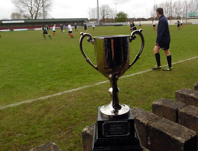 Picture: The Adrian Gibbons 2018 memorial football match under way at Brigg Town FC's Hawthorns ground. The teams were playing for this trophy, remembering the renowned local teacher and footballer. This game is now an established annual event - see Nigel Fisher's Brigg Blog