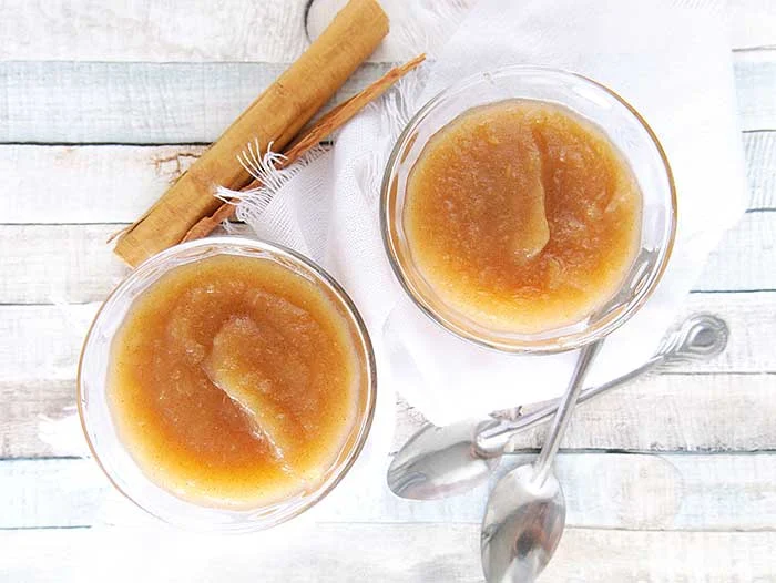 How to make applesauce in an Instant Pot. Use your Instapot to make homemade healthy applesauce with honey and cinnamon. This whole 30 no sugar recipe makes unsweetened applesauce or honey sweetened applesauce, your choice.  Make quick small batch apple sauce for baby or for adults.  You can then make canned applesauce or put it in the freezer to save for later. Freezing recipes is easier ofr his DIY home made recipes. Also gives tips for the best apples to use.  #instantpot #applesauce #apples 