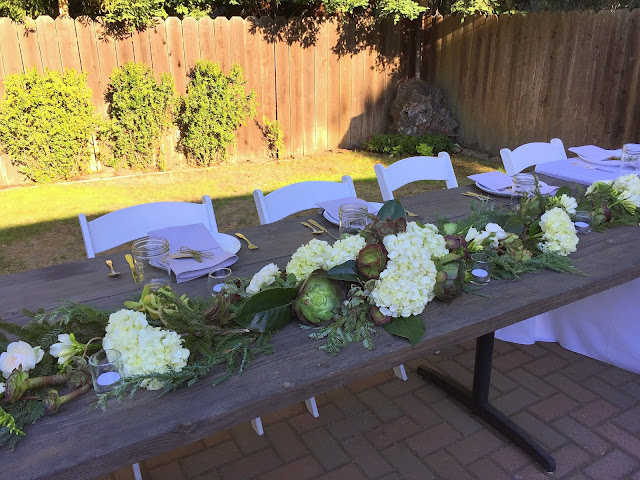 floral table runner with white flowers and succulents