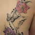 Women Back With Attractive Tattoo Image Of Flowers