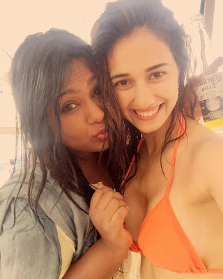 Disha Patani clicking selfie with friends baring her breasts in orange triangular halter bikini top